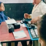 A child undergoing an eye examination during a school-based vision screening camp.